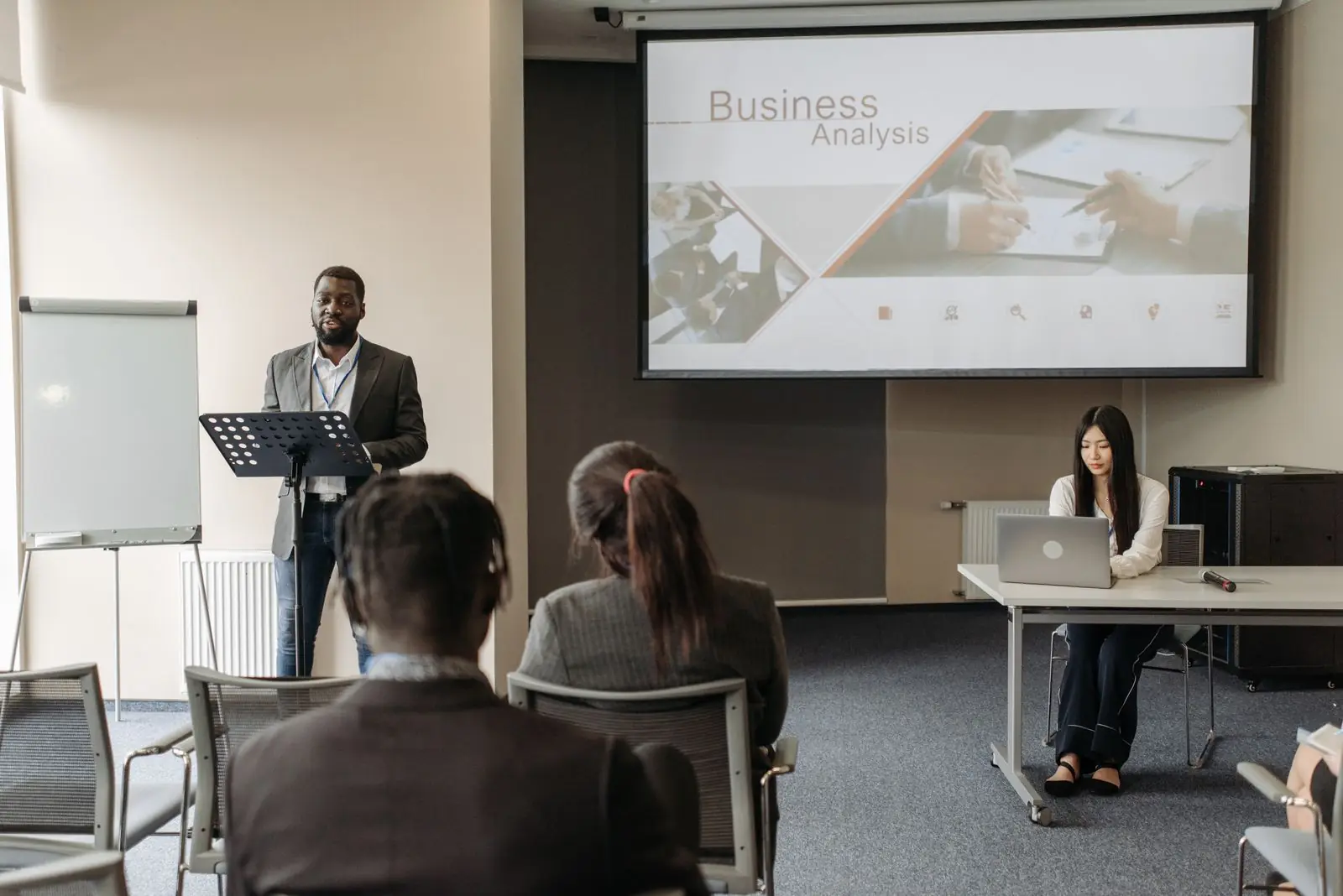 Speaker presenting to an audience at an industry conference