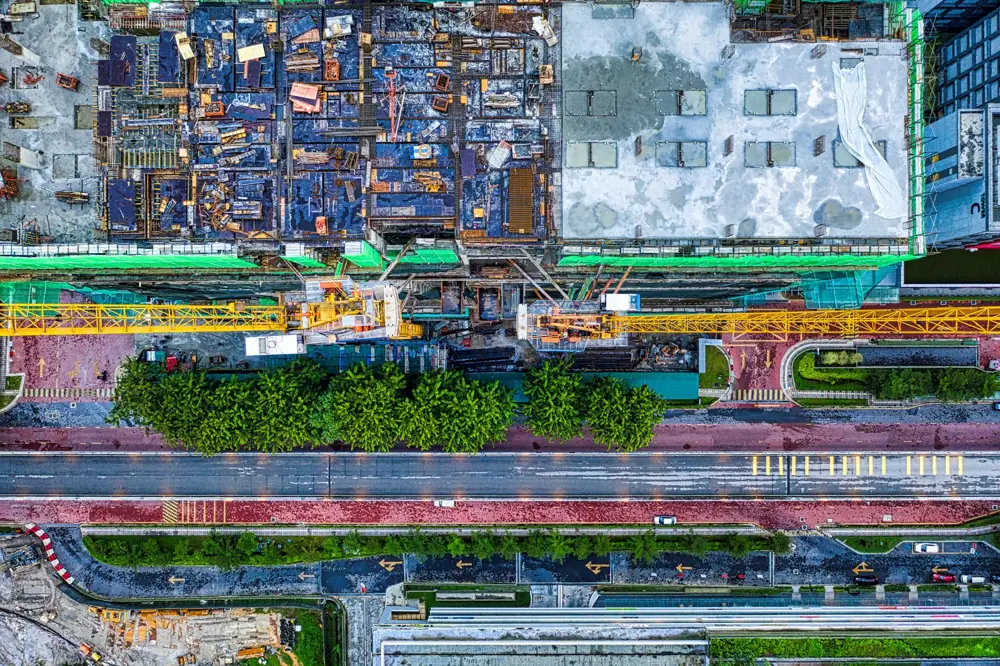 Aerial view of a construction site beside a highway